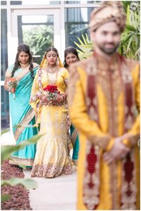 gold and red hindu wedding first look