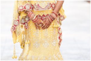 gold and red hindu wedding bride henna