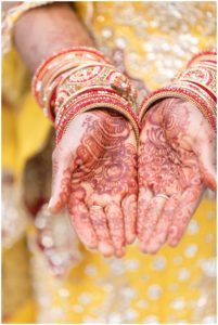 gold and red hindu wedding brides henna