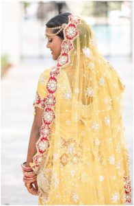 gold and red hindu wedding bride
